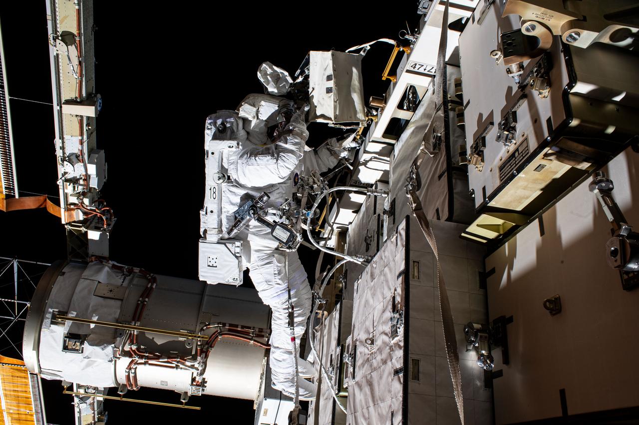 iss063e033443 (June 26, 2020) --- NASA astronaut Bob Behnken is pictured during a spacewalk to swap batteries and upgrade power systems on the International Space Station's Starboard-6 truss structure. Behnken was joined during the six-hour and seven-minute excursion by NASA astronaut Chris Cassidy (out of frame).