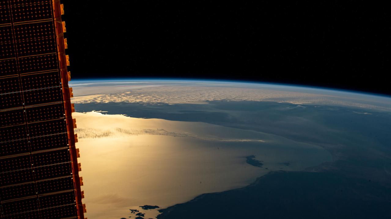 iss063e050071 (July 16, 2020) --- The International Space Station was orbiting above the Northern Territory of Australia when this photograph was taken of the Gulf of Carpentaria including (from bottom left to right) the Pellew Islands, Wellesley Islands and South Wellesley Islands. One of the station's main solar arrays drapes the left side of this photograph.