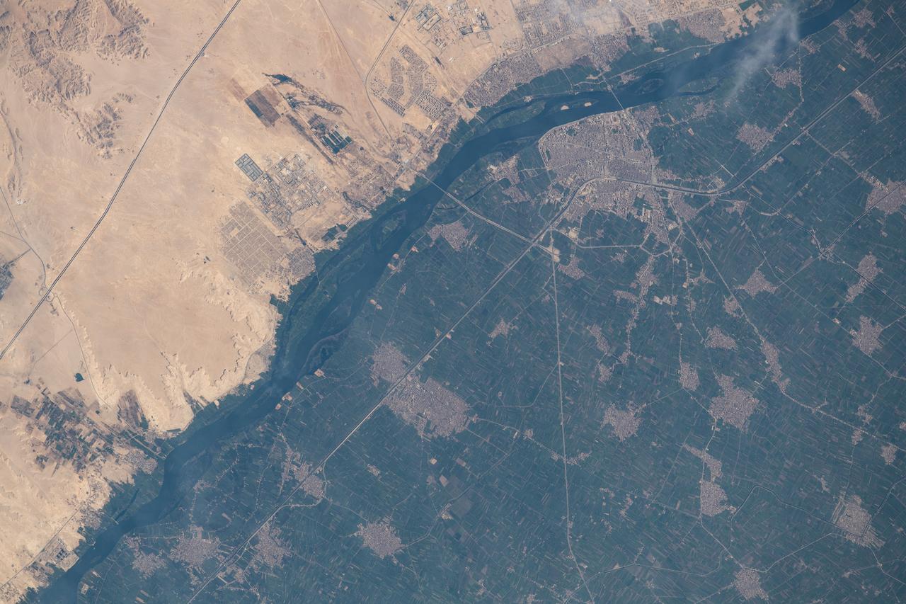 iss063e067888 (Aug. 11, 2020) --- The International Space Station was orbiting above Egypt just east of the Nile River when this photograph was taken of the city of Beni Suef (toward the upper right), an important agricultural trade center on the west bank of the Nile, about 65 miles (110 kilometers) south of Cairo.