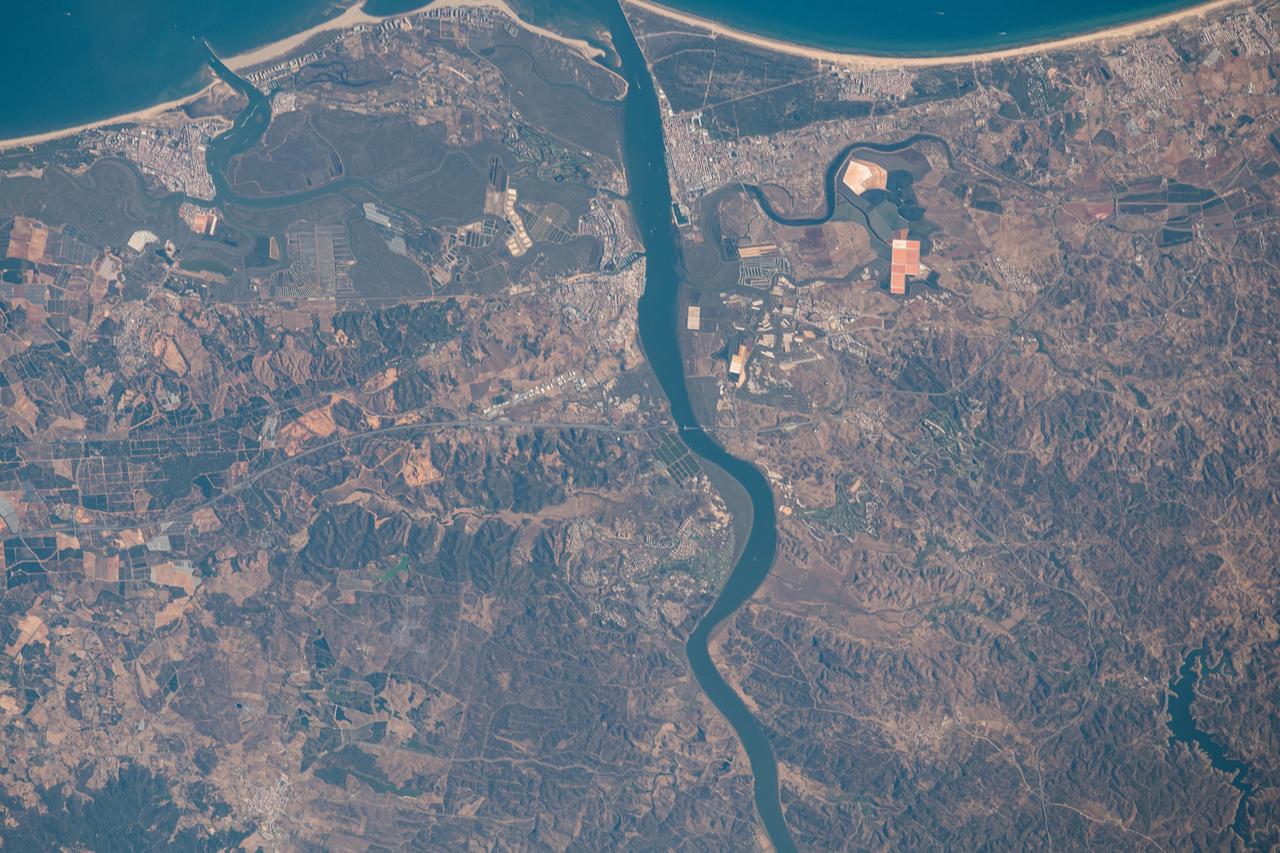 iss063e070330 (Aug. 13, 2020) --- The Guadiana River flows into the Gulf of Cádiz in the Atlantic Ocean and is the border for the southern coastal portions of Portugal (right) and Spain (left)