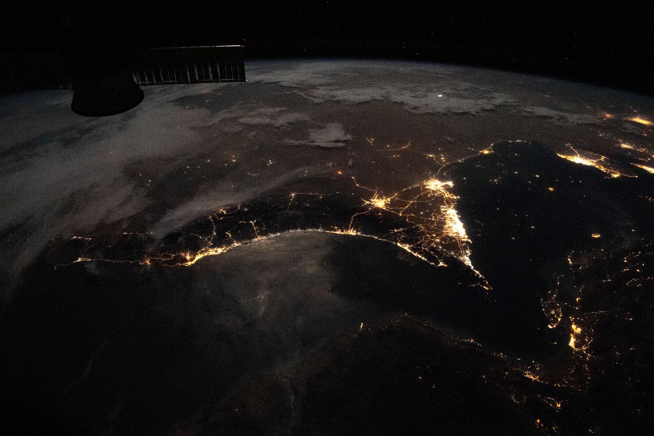 iss063e081357 (Aug. 31, 2020) --- Photographed from the International Space Station at night, the well-lit United Arab Emirates (center right) is situated at the northeast end of the Arabian Peninsula in the southern Persian Gulf, with Qatar and Bahrain (far right) to the north.