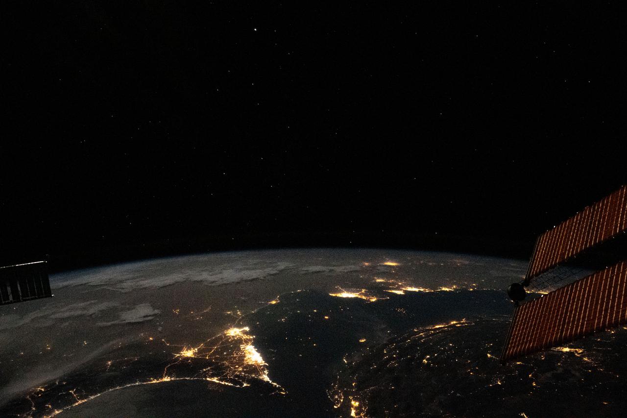 iss063e081369 (Aug. 31, 2020) --- Photographed from the International Space Station at night, the well-lit United Arab Emirates (lower center) is situated at the northeast end of the Arabian Peninsula, with Qatar and Bahrain to the north on the coast of the Persian Gulf.
