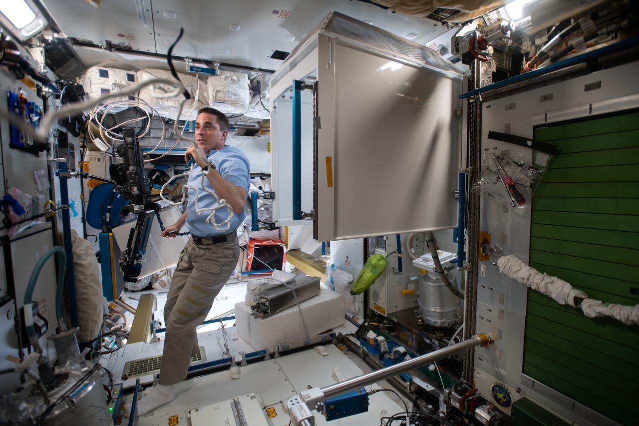 iss063e087493 (Sept. 10, 2020) --- NASA astronaut and Expedition 63 Commander Chris Cassidy calls down to Mission Control and gets ready for high-flying, orbital plumbing work inside the Waste and Hygiene Compartment, the International Space Station's bathroom located inside the Tranquility module.