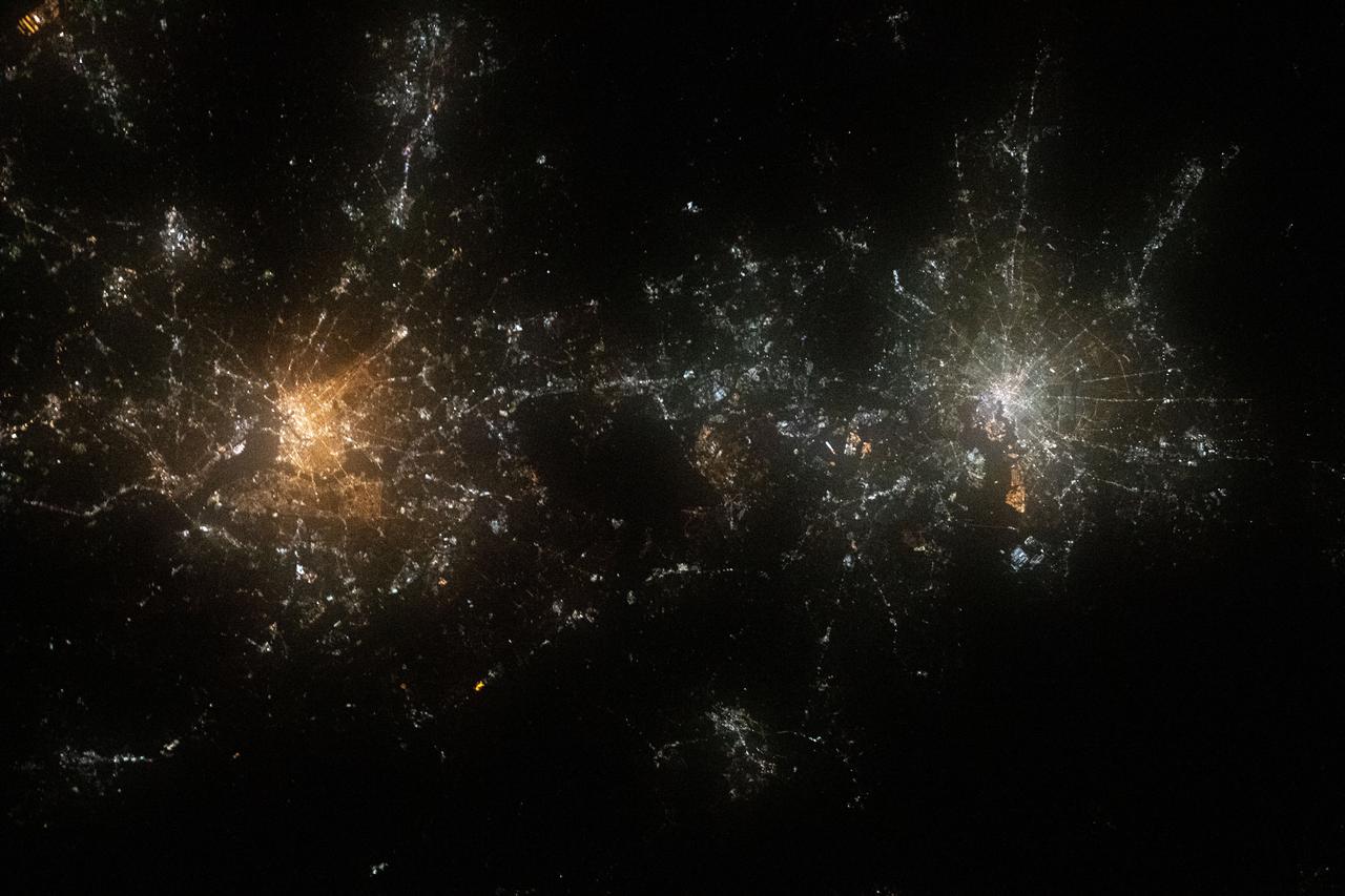 iss063e088344 (Sept. 15, 2020) --- Like two galaxies nearing each other, this nighttime shot from the International Space Station shows the well-lit cities of Washington, D.C. (left), Baltimore, Maryland (right) and their surrounding suburbs.