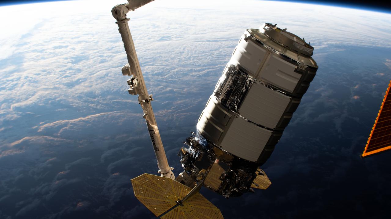 iss063e101638 (Oct. 5, 2020) --- The Northrop Grumman Cygnus space freighter is pictured in the grips of the Canadarm2 robotic arm as mission controllers remotely guide the cargo vehicle to its installation point on the International Space Station's Unity module.