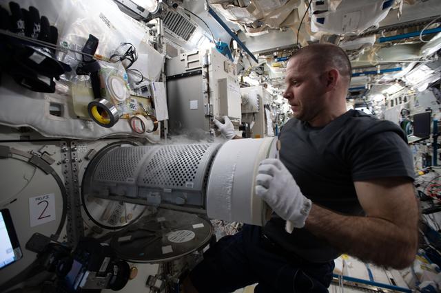 NASA image: Vagner working with MELFI