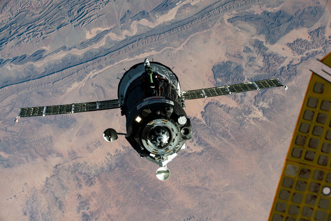 iss063e107170 (Oct. 14, 2020) --- The Soyuz MS-17 spacecraft, with Expedition 64 crew members Kate Rubins of NASA and Roscosmos cosmonauts Sergey Ryzhikov and Sergey Kud-Sverchkov, approaches the International Space Station for a docking to the Rassvet module. This photograph was taken as both spacecraft were orbiting above Morocco.