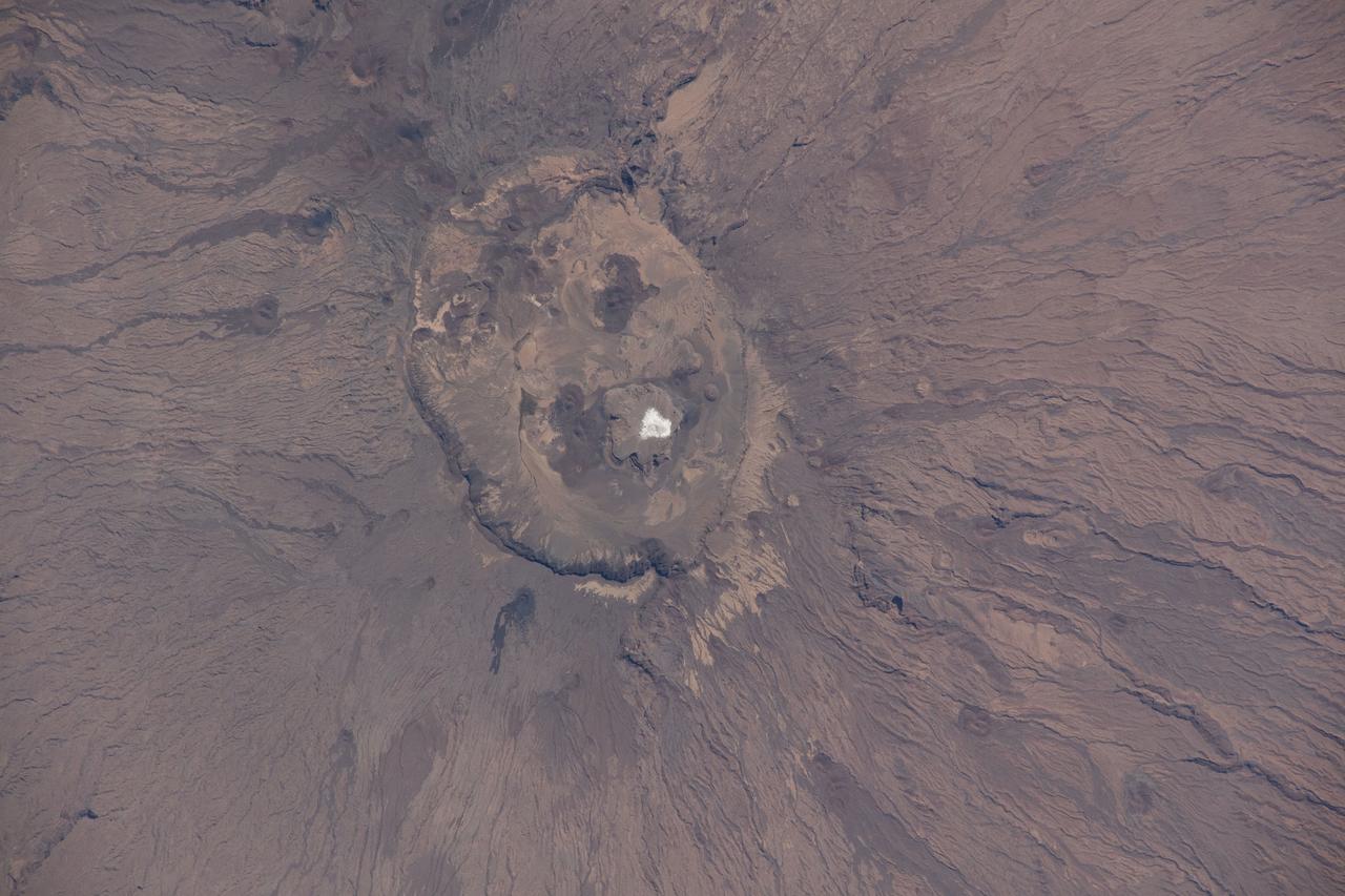 iss064e000448 (Oct. 25, 2020) --- Emi Koussi, a high pyroclastic shield volcano in northern Chad, is also the highest mountain in the Sahara. The International Space Station was orbiting above the Tibesti Mountains in Chad when this photograph was taken.