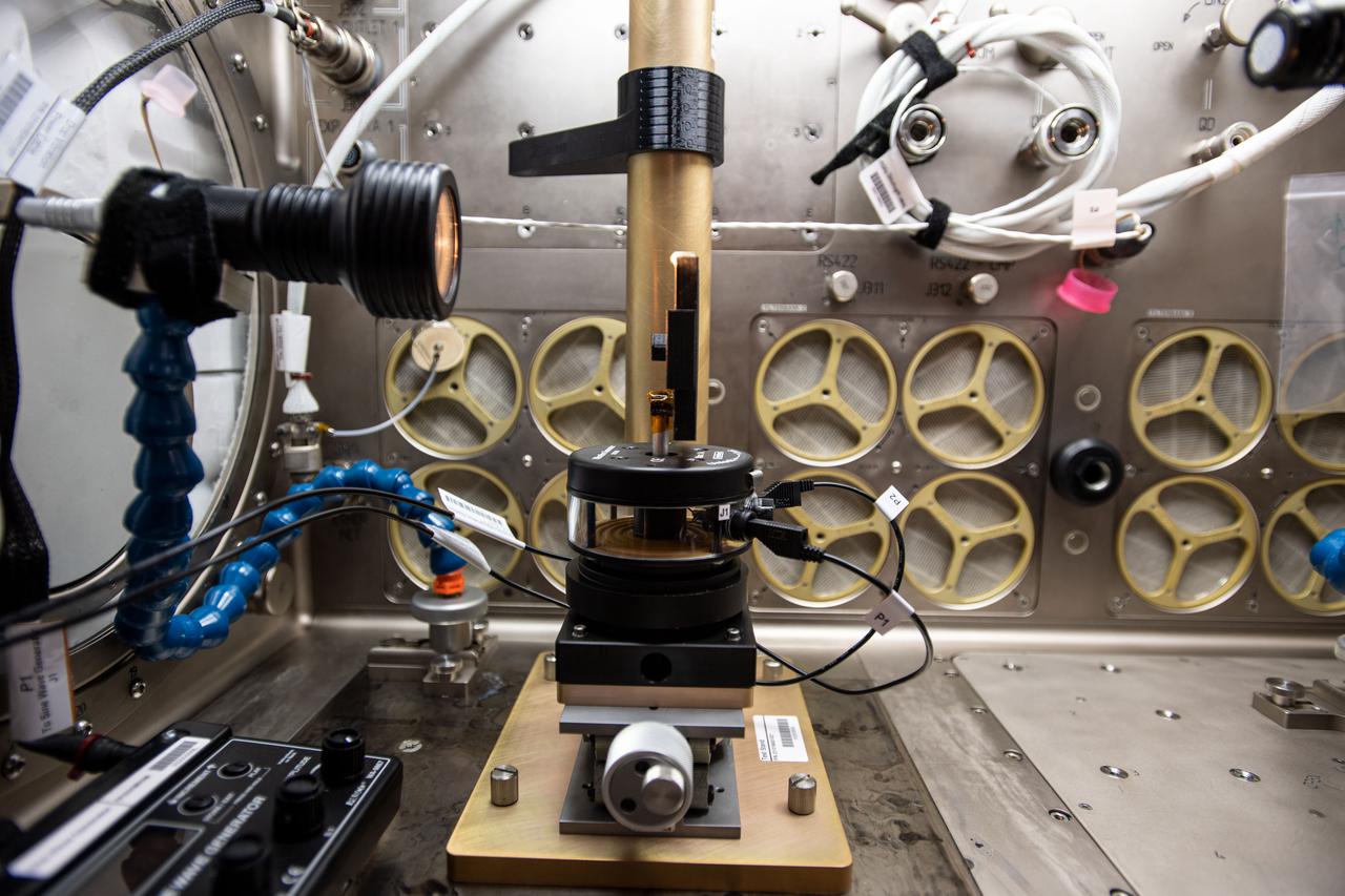 iss064e002375 (1/15/2017) --- Photo documentation of Inertial Spreading with Vibration and Water Coalescence (Drop Vibration) experiment hardware set up inside the Microgravity Science Glovebox (MSG) aboard the International Space Station (ISS). Inertial Spreading with Vibration and Water Coalescence (Drop Vibration) examines the behavior of big liquid drops whose perimeter of contact, called the contact line, moves rapidly as the drops change shape either forced by vibration or freely by merger.