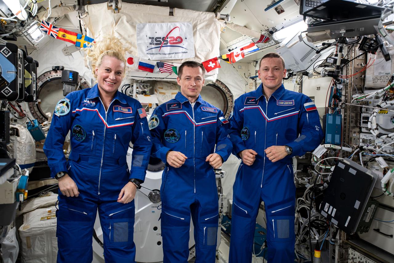 iss064e002617 (Oct. 30, 2020) --- The three-member Expedition 64 crew gathers for a portrait inside the Kibo laboratory module from JAXA (Japan Aerospace Exploration Agency). From left are, Flight Engineer Kate Rubins of NASA, Commander Sergey Ryzhikov of Roscosmos and Flight Engineer Sergey Kud-Sverchkov of Roscosmos.