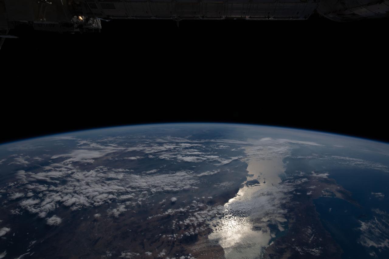 iss064e002894 (Nov. 1, 2020) --- The Earth's limb, or horizon, with the Sun's glint beaming off the Gulf of California, is pictured as the International Space Station orbited above southern California.
