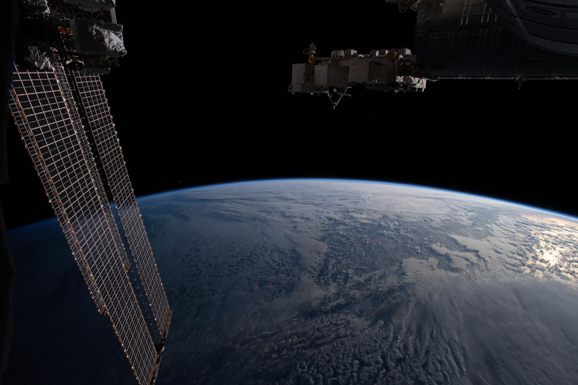 The Earth's limb, or horizon, is pictured as the International Space Station orbited above the north Pacific near Alaska's Aleutian Islands.