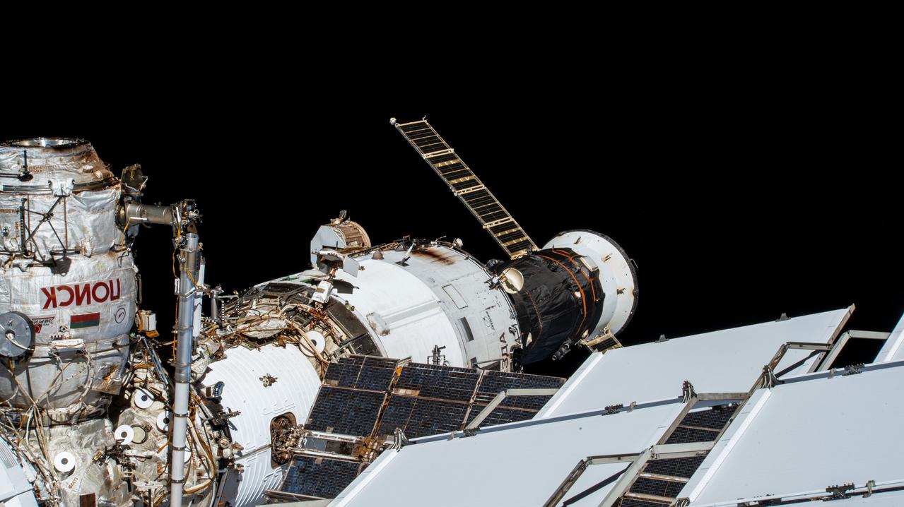iss064e004312 (Nov. 13, 2020) --- The Russian segment of the International Space Station is pictured from an external high definition camera. At far left, is the Poisk mini-research module attached to the forward space-facing port of the Zvezda service module. Docked to the rear port of Zvezda is the Progress 75 resupply ship.