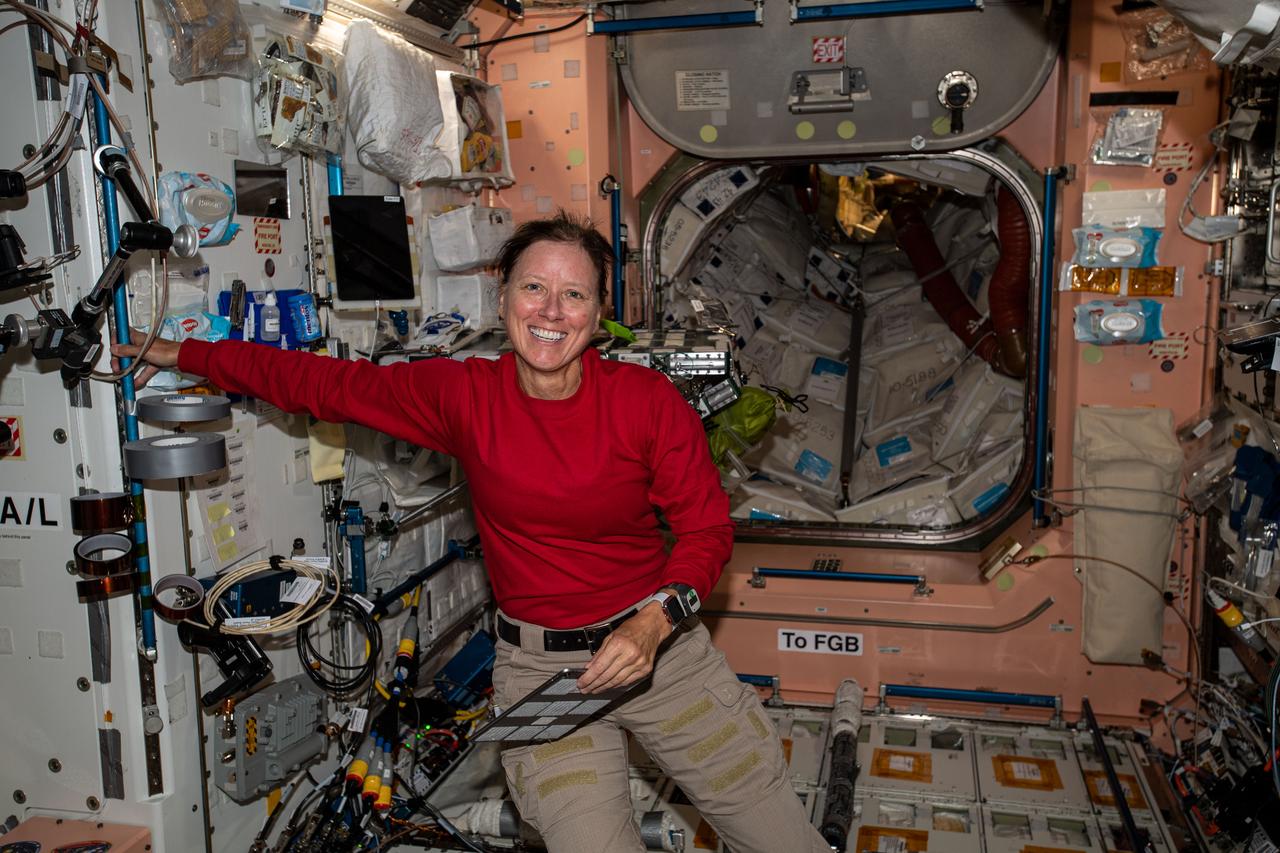 iss064e005612 (Nov. 24, 2020) --- NASA astronaut and Expedition 64 Flight Engineer Shannon Walker pauses during maintenance work and smiles for a portrait inside the Unity module.