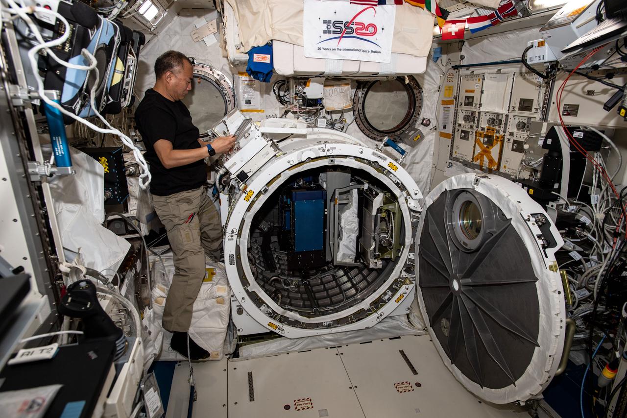 iss064e008416 (Dec. 1, 2020) --- JAXA (Japan Aerospace Exploration Agency) astronaut Soichi Noguchi is pictured reviewing procedures to remove external experiment hardware from inside the Kibo laboratory module's airlock.
