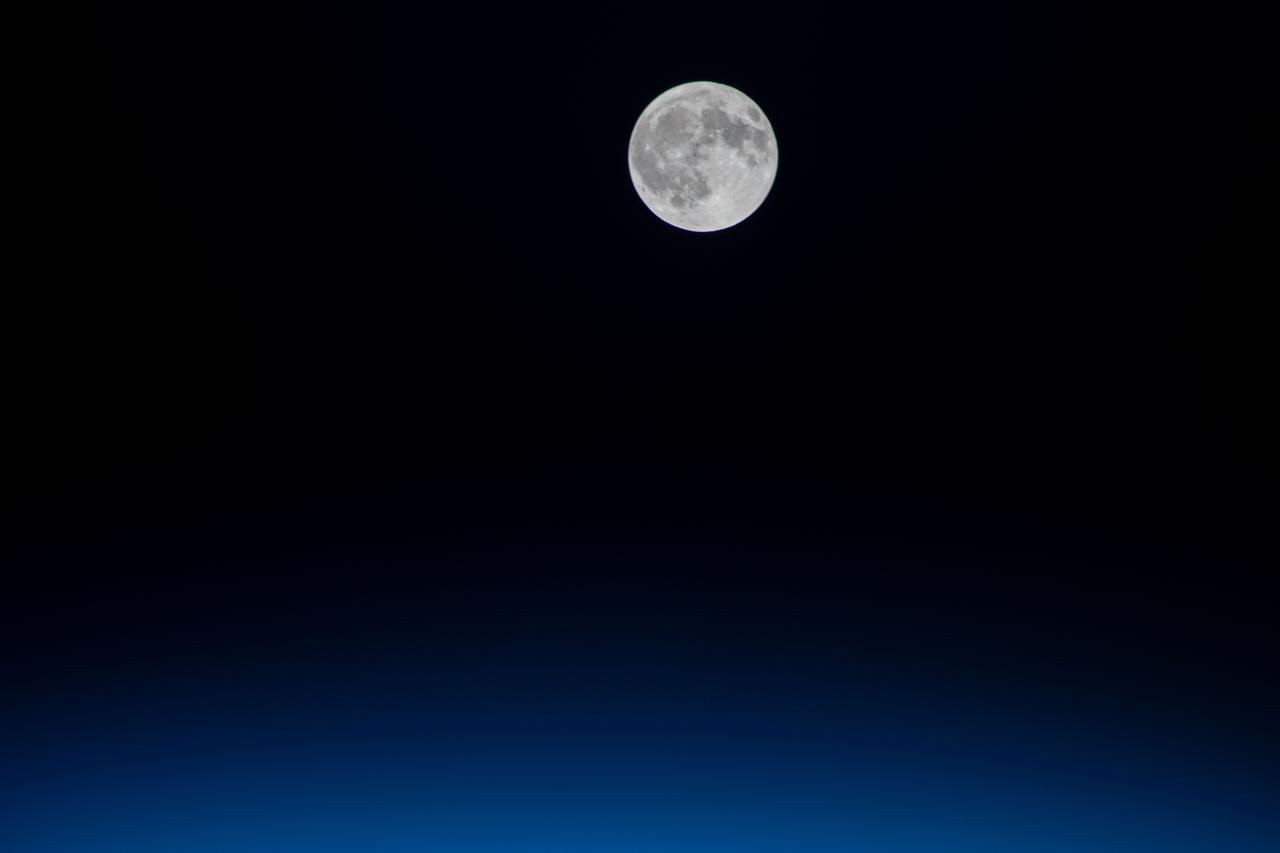 iss064e008767 (Nov. 30, 2020) --- The full Moon is pictured from the International Space Station as it orbited above the Atlantic Ocean off the coast of Portugal.