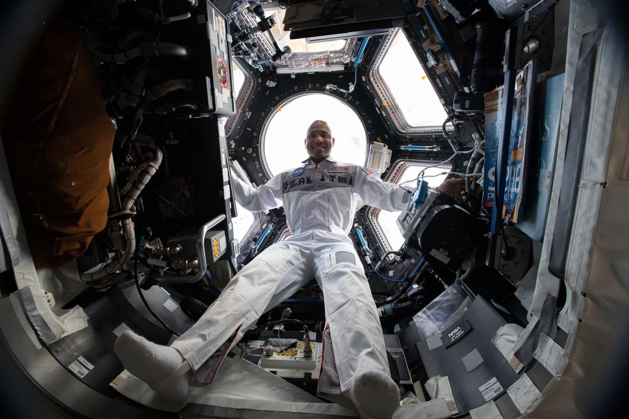 iss064e009108 (Dec. 3, 2020) --- NASA astronaut and Expedition 64 Flight Engineer Victor Glover is pictured inside the cupola, the International Space Station's "window to the world," as the orbiting lab flew 263 miles above France.