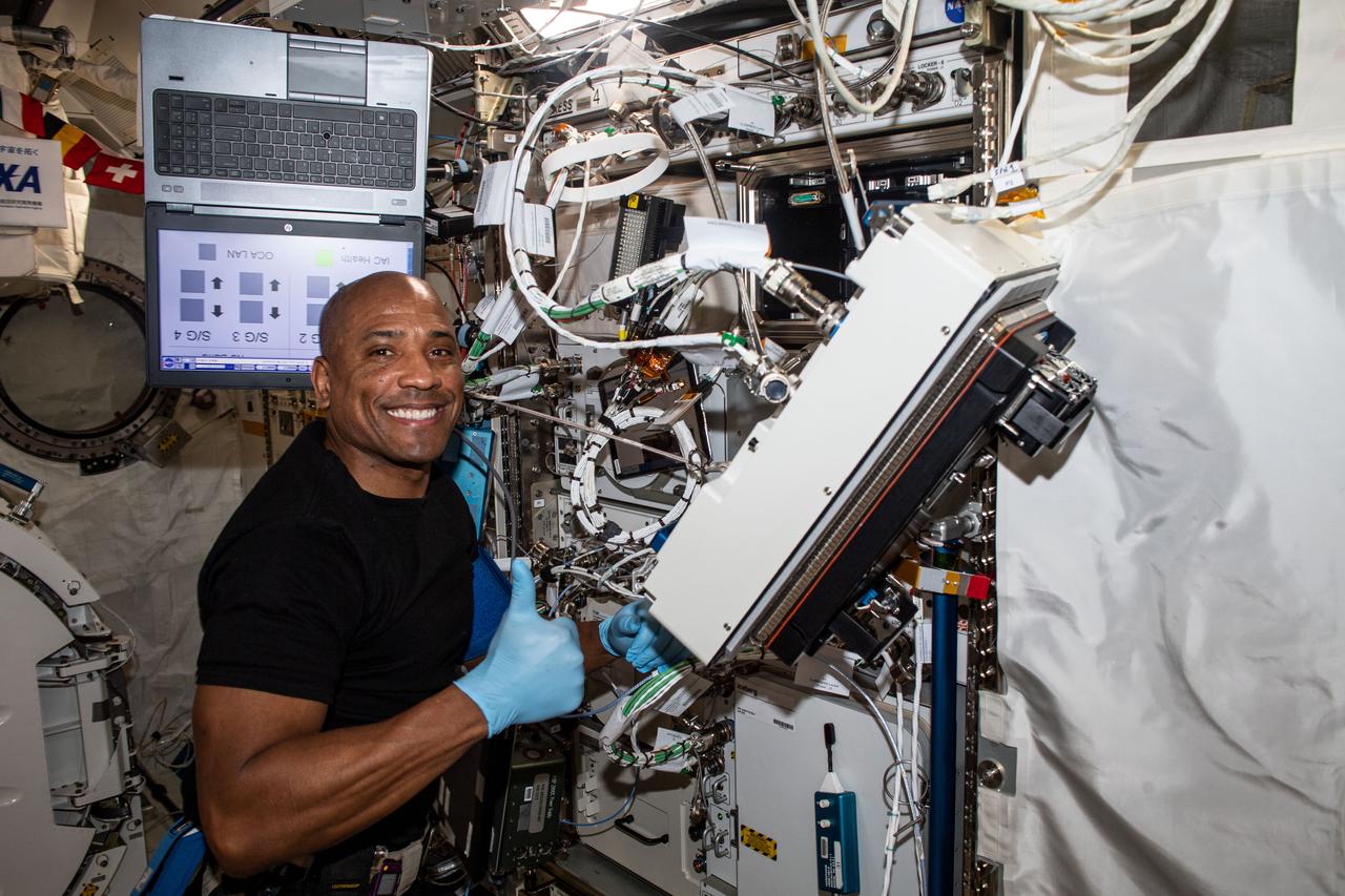 iss064e010944 (Dec. 8, 2020) --- NASA astronaut and Expedition 64 Flight Engineer Victor Glover is pictured inside Japan's Kibo laboratory module installing research gear that will develop a biological model to study the effects of spaceflight on musculoskeletal disease. The investigation could lead to drugs that will prevent the progression of the disease.