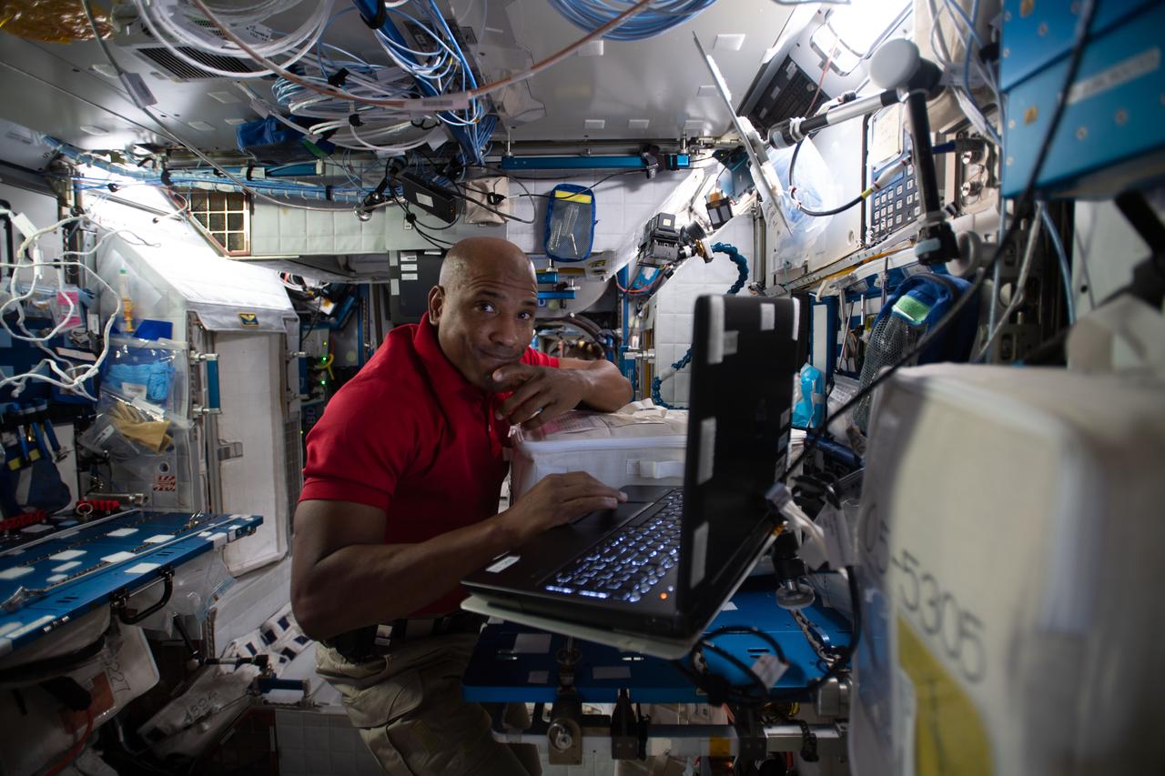 iss064e011646 (Dec. 10, 2020) --- NASA astronaut and Expedition 64 Flight Engineer Victor Glover reviews procedures on a computer for the Monoclonal Antibodies Protein Crystal Growth (PCG) experiment inside the Harmony module. The biomedical study crystallizes therapeutic monoclonal antibodies of higher quality than Earth and could accelerate the development of advanced therapies that target cancer cells.