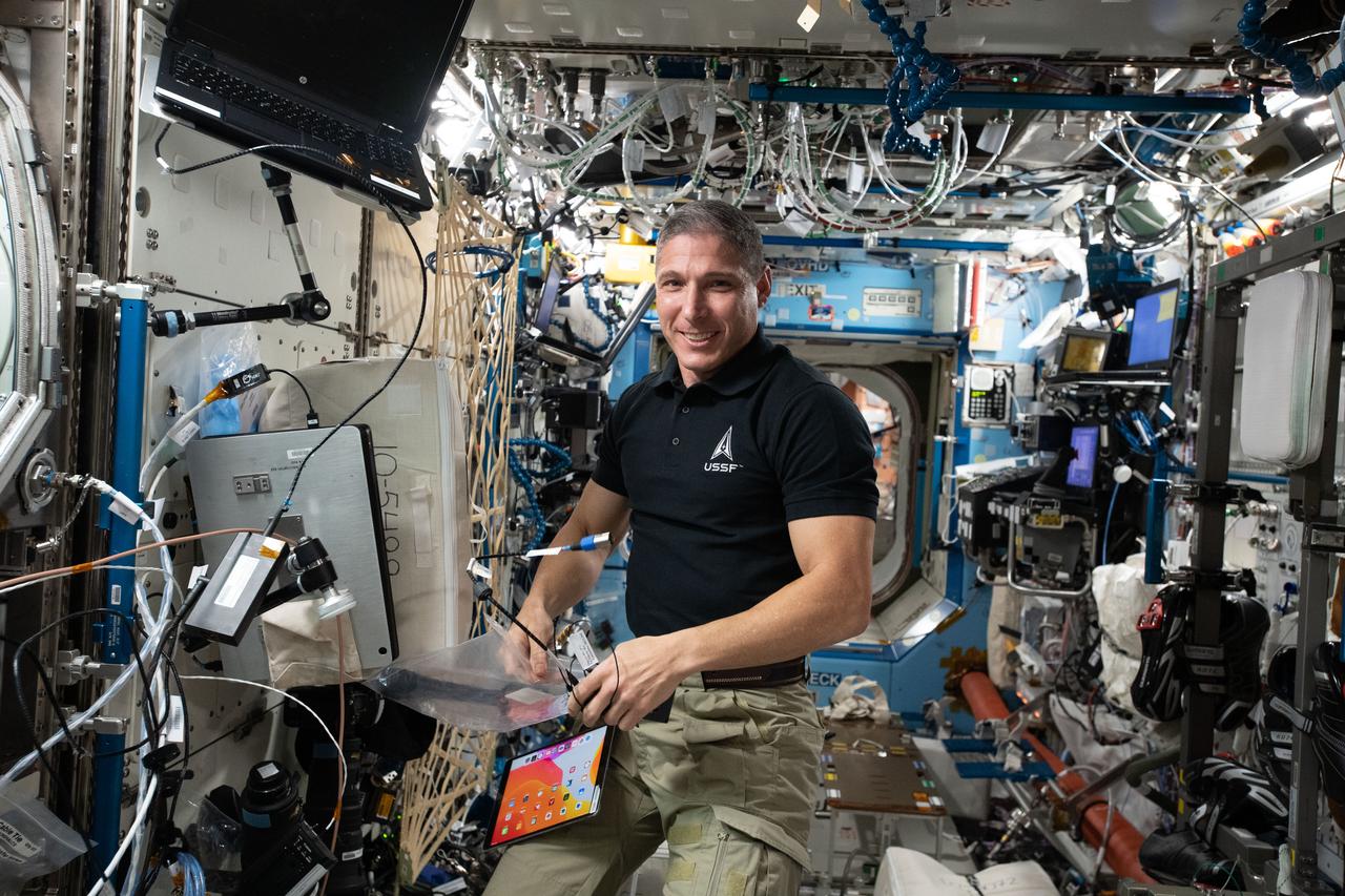 iss064e013883 (Dec. 18, 2020) --- NASA astronaut and Expedition 64 Flight Engineer Michael Hopkins pauses for a portrait during a break in science activities inside the International Space Station's U.S. Destiny laboratory module.