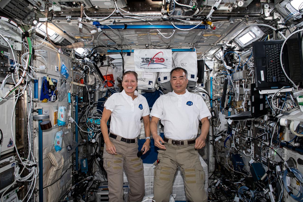 iss064e016868 (Dec. 30, 2020) --- NASA astronaut Shannon Walker and JAXA astronaut Soichi Noguchi take a moment to pose for a portrait together inside the Japanese Kibo laboratory module.