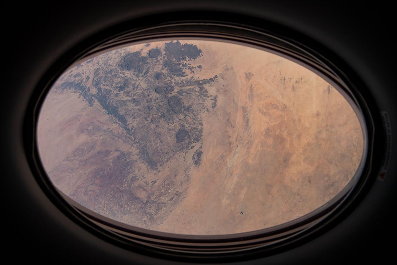 iss064e020109 (Jan. 5, 2021) --- This view from a window on the SpaceX Crew Dragon vehicle docked to the International Space Station looks at a portion of the Sahara Desert in the African nation of Niger 260 miles below.