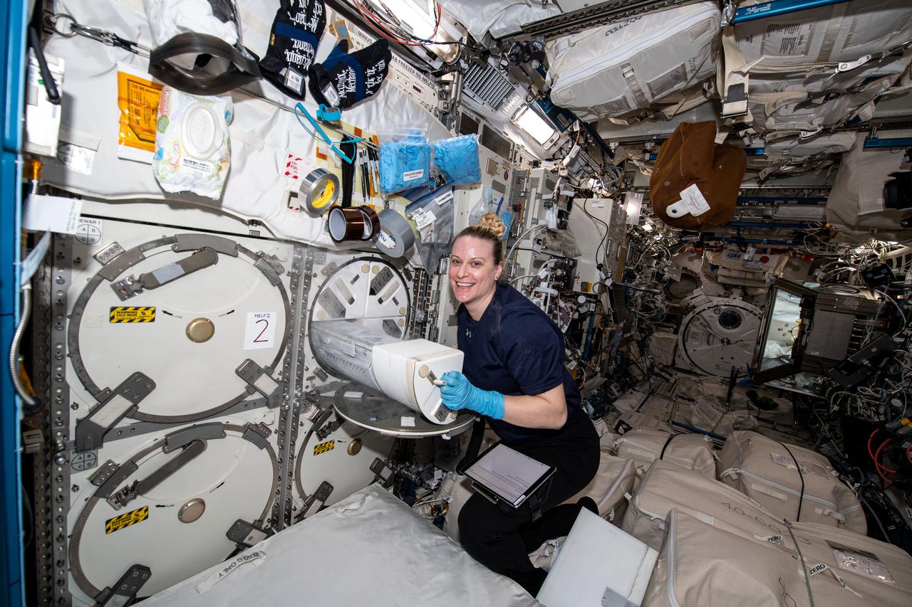 iss064e020142 (Jan. 5, 2021) --- Expedition 64 Flight Engineer and NASA astronaut Kate Rubins loads engineered heart tissue samples into a science freezer for preservation and later analysis. The science freezer, located in the Japanese Kibo laboratory module, is known as the Minus Eighty-Degree Laboratory Freezer for ISS (MELFI) and maintains experiment samples at ultra-cold temperatures throughout a mission.