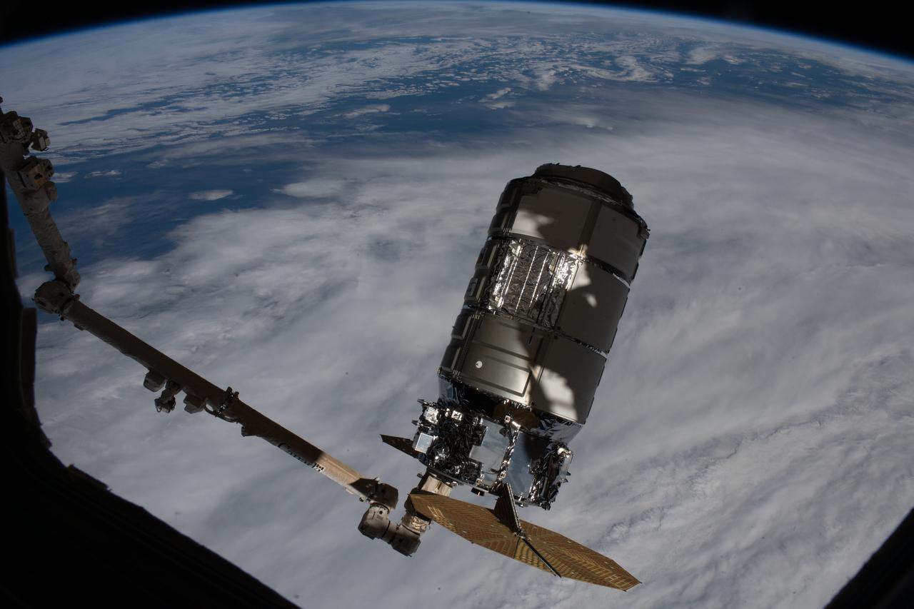 iss064e020615 (Jan. 2021) --- The Northrop Grumman Cygnus space freighter is pictured attached to the Canadarm2 robotic arm after it had been uninstalled from the International Space Station's Unity module. Robotics controllers would command the Canadarm2 a few hours later to release Cygnus after 93 days attached to Unity.