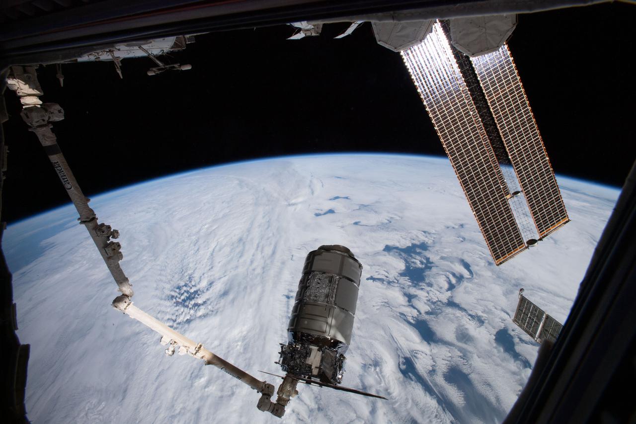 iss064e020720 (Jan. 2021) --- The Northrop Grumman Cygnus space freighter is pictured attached to the Canadarm2 robotic arm after it had been uninstalled from the International Space Station's Unity module. Robotics controllers would command the Canadarm2 a few hours later to release Cygnus after 93 days attached to Unity.