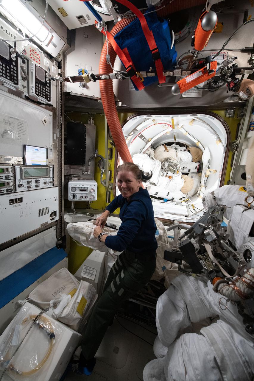 iss064e022228 (Jan. 11, 2021) --- NASA astronaut and Expedition 64 Flight Engineer Shannon Walker works inside the U.S. Quest airlock servicing a variety of life support hardware and electrical components.