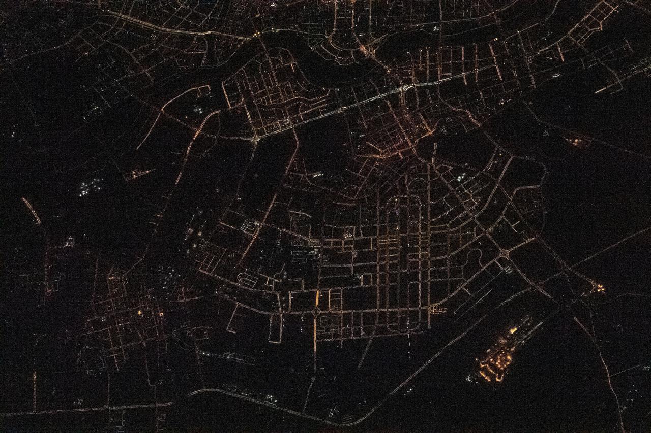 iss064e023828 (Jan. 16, 2021) --- This night time shot of Shenyang, China, with the Hunhe River flowing though it, was taken from the International Space Station as it orbited 262 miles above the world's most-populous nation.