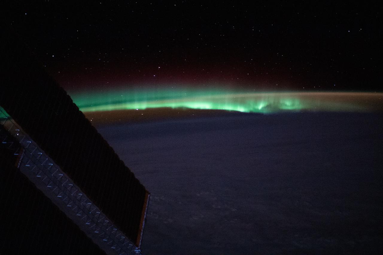 iss064e024068 (Feb. 1, 2021) --- Earth's atmospheric glow and the aurora blanket the horizon as the International Space Station orbited 263 miles above the North Atlantic just off the coast of Newfoundland and Labrador.