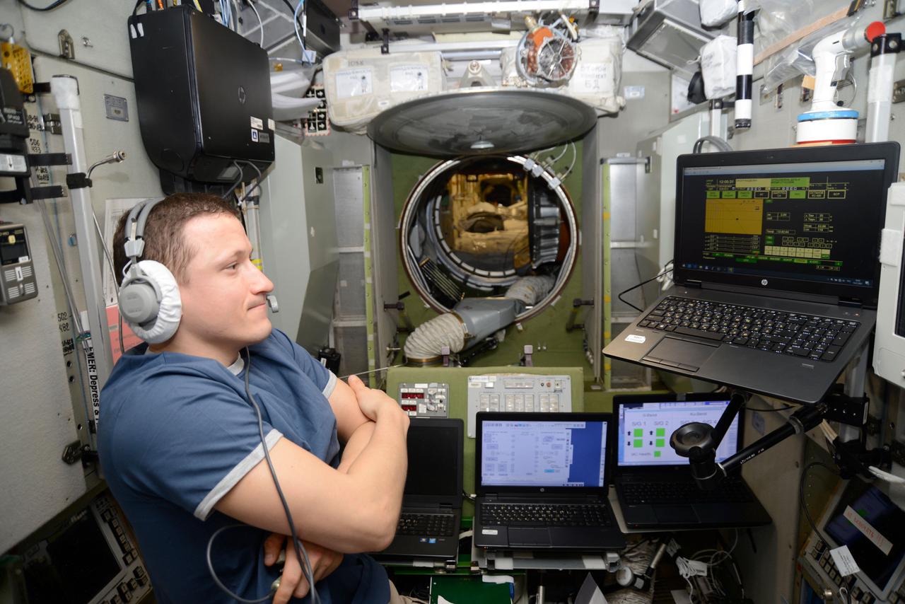 iss064e024167 (Jan. 19, 2021) --- Roscosmos cosmonaut and Expedition 64 Flight Engineer Sergey Kud-Sverchkov reviews emergency escape procedures on a computer in the unlikely event the crew would have to evacuate the station and quickly undock inside their Soyuz crew ship.
