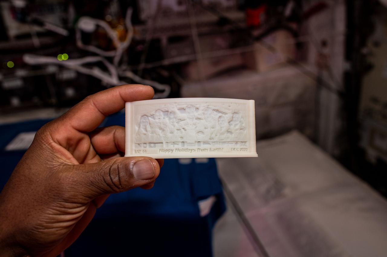 ss064e024233 (1/20/2021) --- A view of the Year 2020 Print, printed in the Additive Manufacturing Facility (AMF) Manufacturing Device (ManD) aboard the International Space Station (ISS). The Bellevue High School 2020 Print project uses the space station’s Manufacturing Device – Additive Manufacturing Facility (AMF) to provide students a behind-the-scenes experience with the 3D prinitng process in microgravity. 