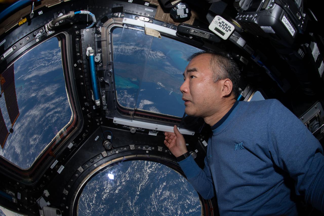 iss064e025495 (Jan. 21, 2021) --- JAXA (Japan Aerospace Exploration Agency) astronaut and Expedition 64 Flight Engineer Soichi Noguchi enjoys the view of Earth below from the seven-windowed cupola as the International Space Station orbited 260 miles above the Caribbean Sea.