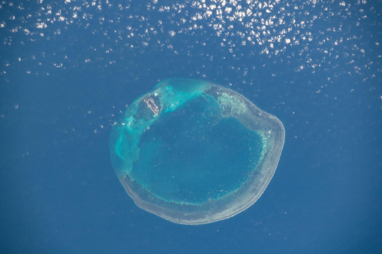 iss064e026165 (Jan. 26, 2021) --- The Republic of China's Dongsha Atoll National Park is pictured from the International Space Station as it orbited 261 miles above the South China Sea.