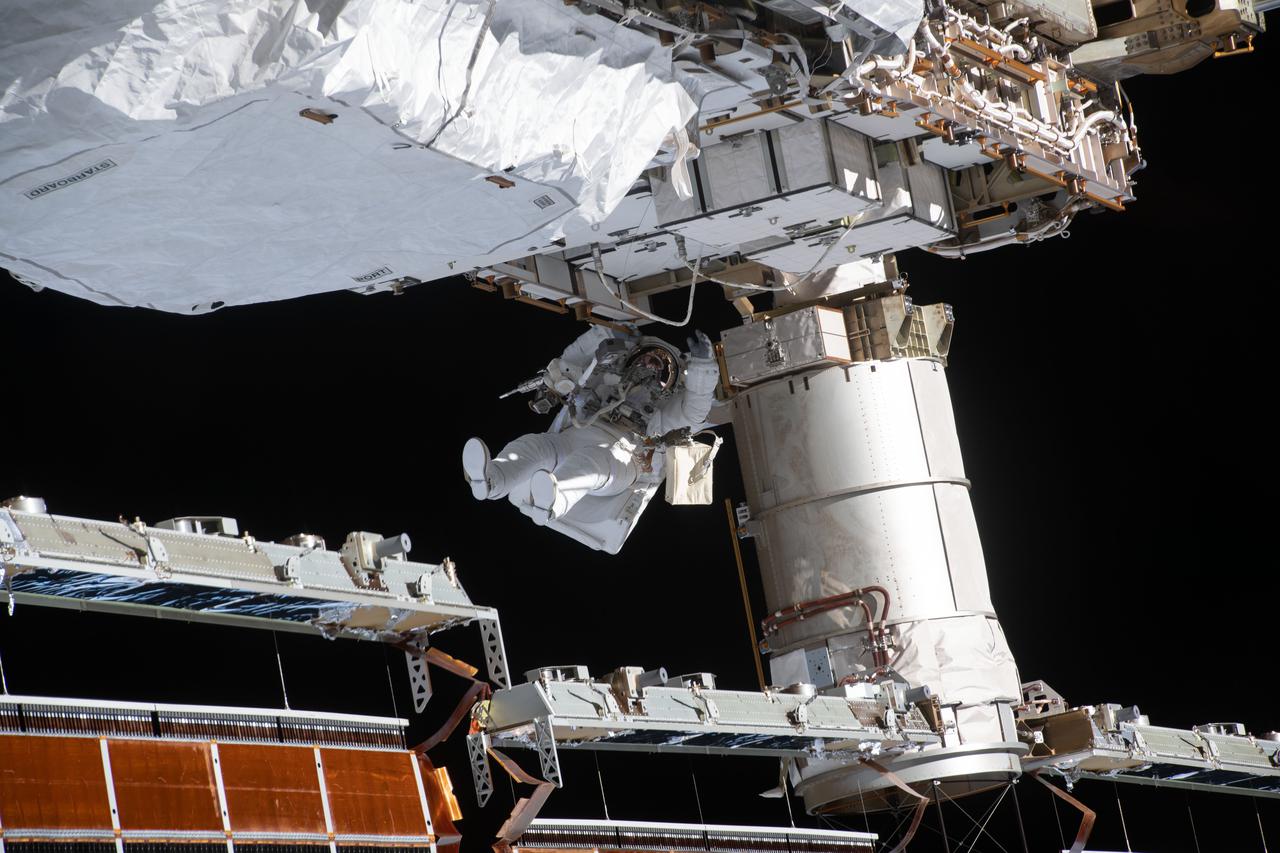 iss064e027226 (Jan. 27, 2021) --- NASA spacewalker and Expedition 64 Flight Engineer Victor Glover works to ready the International Space station's port-side truss structure for future solar array upgrades.