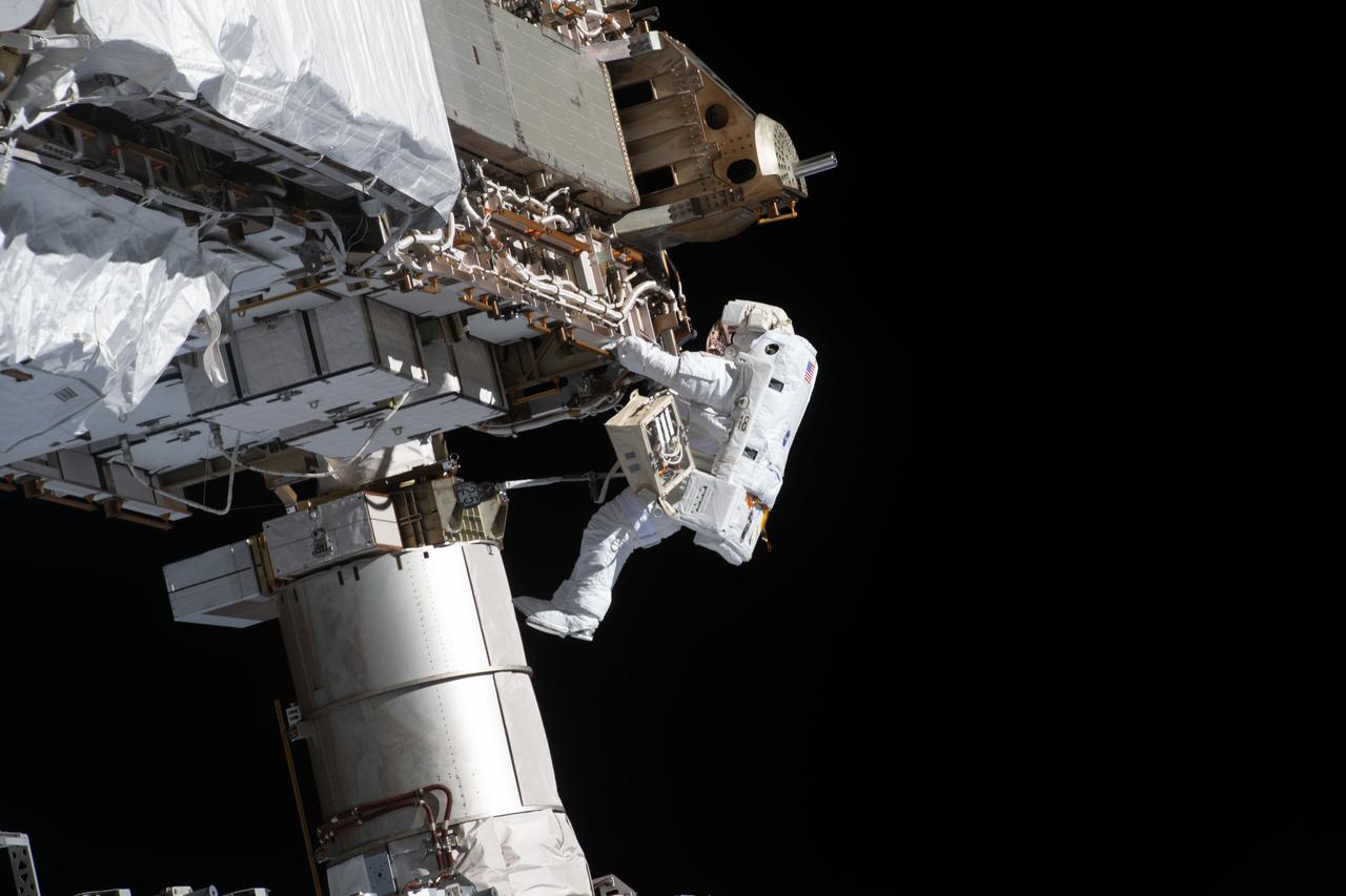 iss064e027247 (Jan. 27, 2021) --- NASA spacewalker and Expedition 64 Flight Engineer Victor Glover works to ready the International Space station's port-side truss structure for future solar array upgrades.