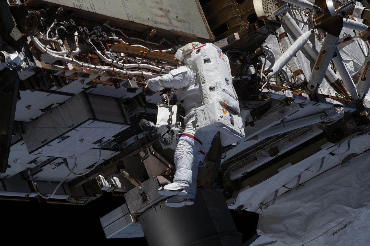 iss064e027386 (Jan. 27, 2021) --- NASA spacewalker and Expedition 64 Flight Engineer Michael Hopkins works to ready the International Space station's port-side truss structure for future solar array upgrades.