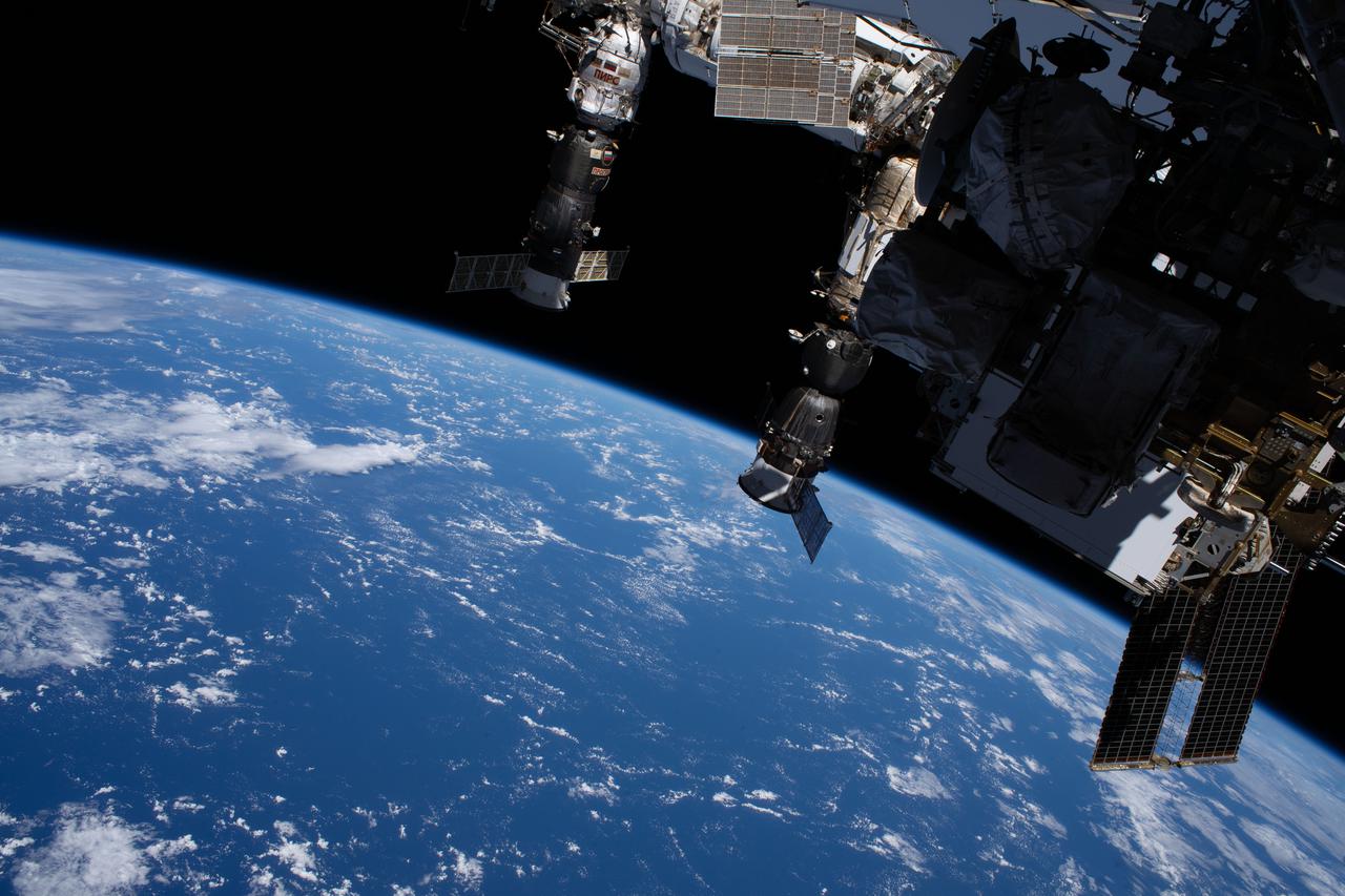 iss064e027923 (Feb. 1, 2021) --- This photograph of two Russian spaceships, (from left) the Progress 76 resupply ship and the Soyuz MS-17 crew ship, docked to the International Space Station was taken by NASA astronaut Michael Hopkins during a spacewalk he conducted with fellow NASA astronaut Victor Glover (both out of frame). The space station was orbiting 263 miles above the Pacific Ocean off the coast of South America at the time this picture was taken.