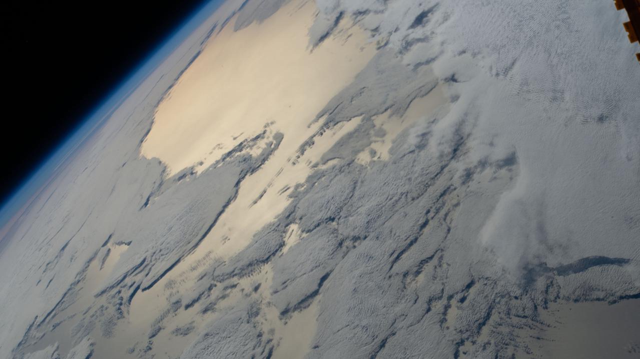 iss064e029006 (Feb. 4, 2021) --- This view of the Earth's horizon looks across a cloudy Atlantic Ocean as the International Space Station orbited 271 miles above off the coast of southern Argentina in South America.