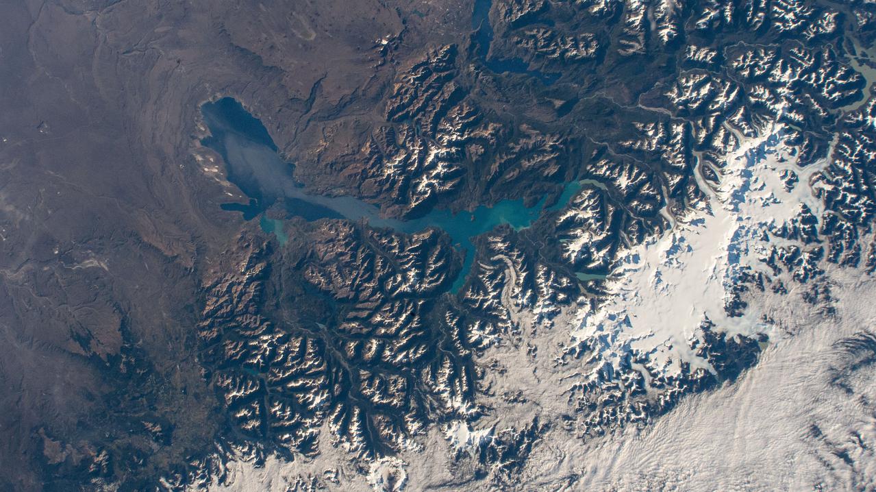 iss064e029029 (Feb. 2, 2021) --- Laguna San Rafael National Park comprises General Carrera Lake and the snow-capped peaks of the Andes in this picture from the International Space Station as it orbited 270 miles above southern Chile in South America.