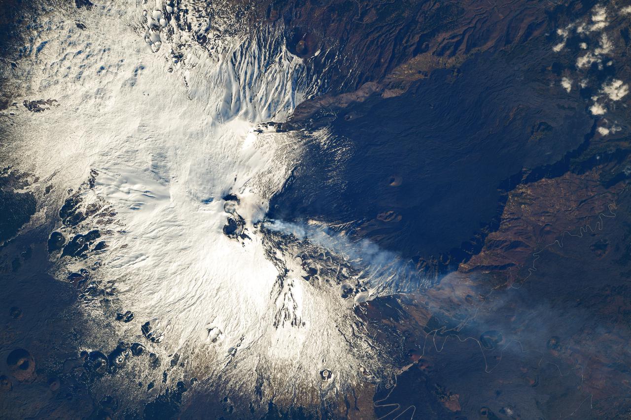 iss064e029306 (Feb. 3, 2021) --- Mount Etna, an active volcano on the east coast of Sicily, Italy, is pictured from the International Space Station as it orbited 263 miles above. Credit: Roscosmos