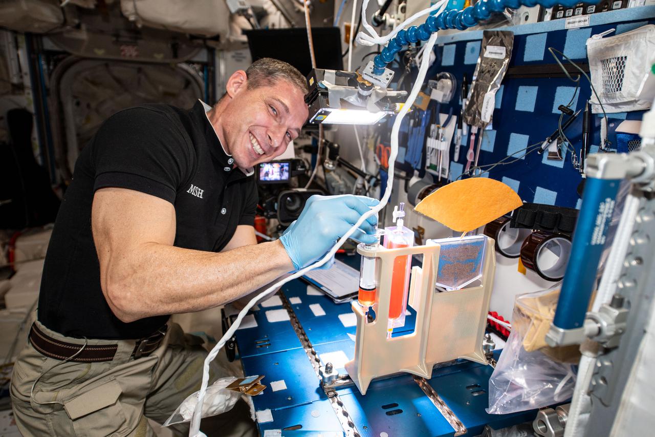 iss064e030009 (Feb. 8, 2021) --- NASA astronaut and Expedition 64 Flight Engineer Michael Hopkins works on hydroponics components for the Plant Water Management study that is exploring ways to sustain plants in microgravity from germination through harvest.