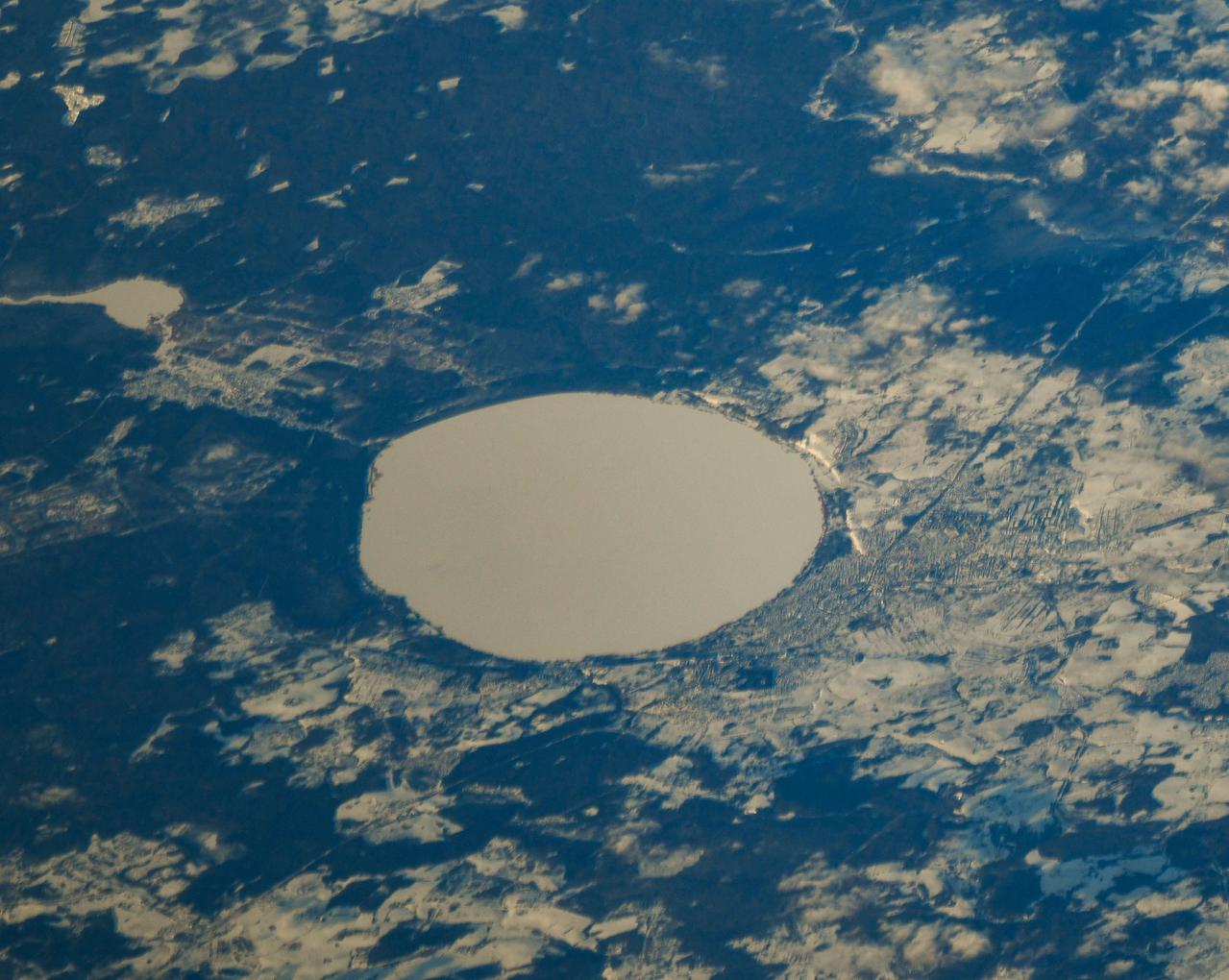 iss064e030131 (Feb. 8, 2021) --- The ice-covered Lake Pleshcheyevo, with the town of Pereslavl-Zalessky on its coast, in Russia is pictured from the International Space Station as it orbited 265 miles above the Ukraine-Russia border. Credit: Roscosmos