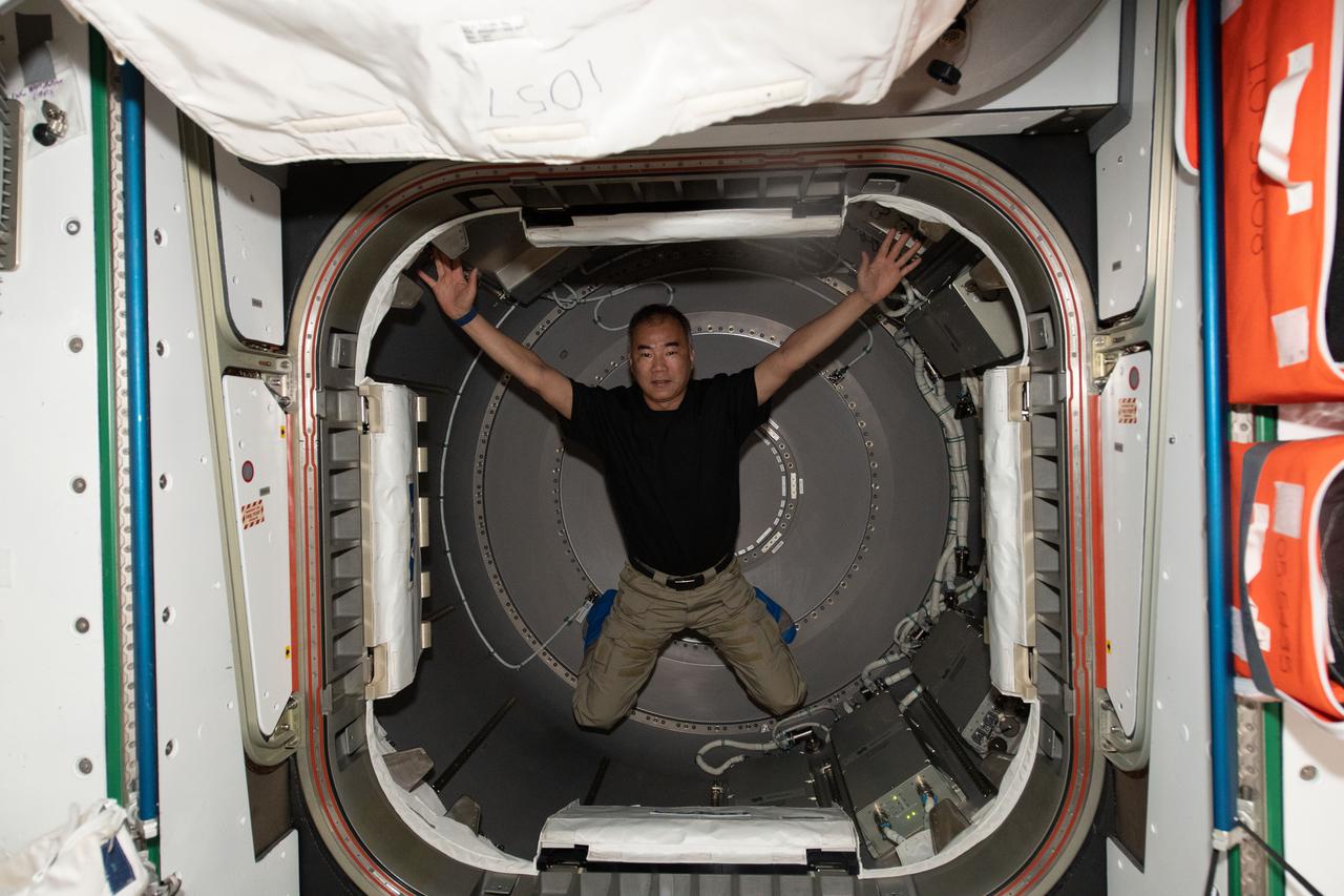 iss064e031300 (Feb. 11, 2021) --- JAXA (Japan Aerospace Exploration Agency) astronaut and Expedition 64 Flight Engineer Soichi Noguchi occupies the newly-opened NanoRacks Bishop airlock attached to the Tranquility module. Bishop will enable more commercial research, satellite deployments, and cargo operations outside in the vacuum of space.