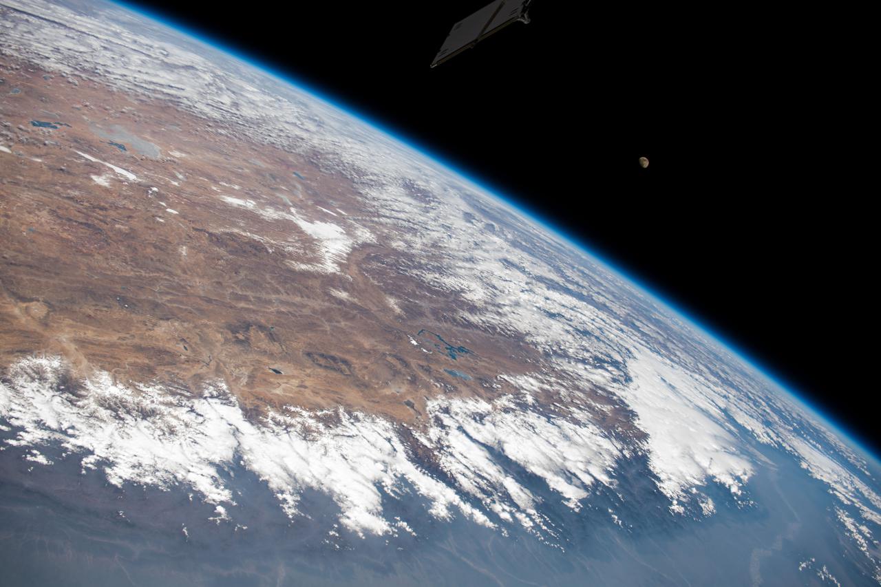 iss064e037041 (Feb. 23, 2021) --- The photograph looks across India, the Himalayas, and into China as the International Space Station orbited 264 miles above. A waxing gibbous Moon is pictured above the Earth's horizon.
