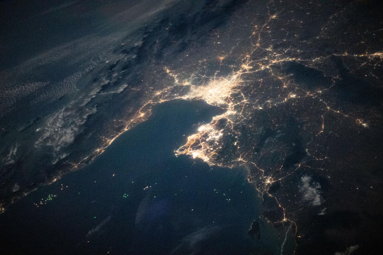 iss064e037842 (Feb. 26, 2021) --- The night lights of Bangkok, the capital of Thailand, on the Gulf of Thailand, are pictured from the International Space Station as it orbited 260 miles above the southern coast of Vietnam.