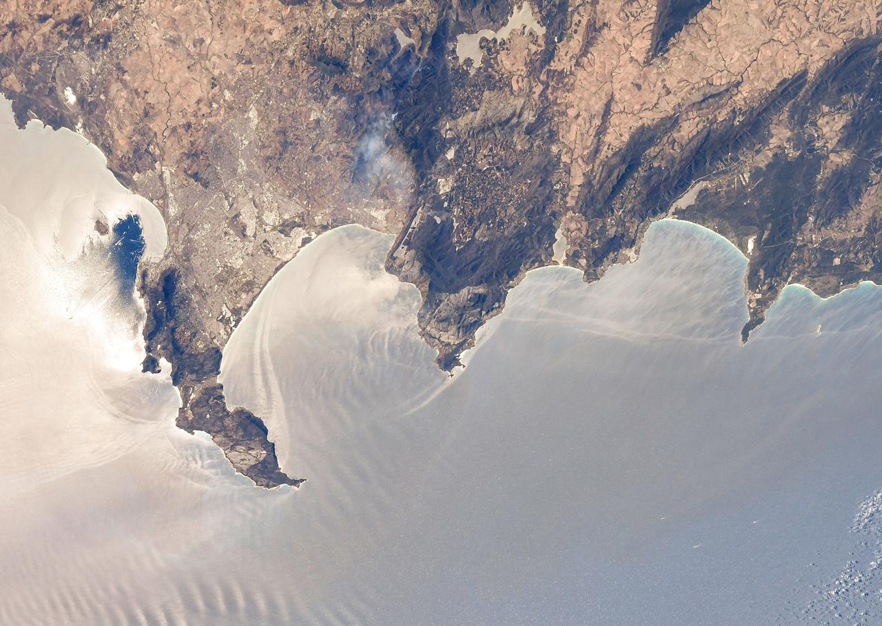 iss064e038871 (Feb. 28, 2021) --- Cape Town in South Africa is pictured with the Sun's glint beaming off the South Atlantic coast as the International Space Station orbited 269 miles above. Credit: Roscosmos