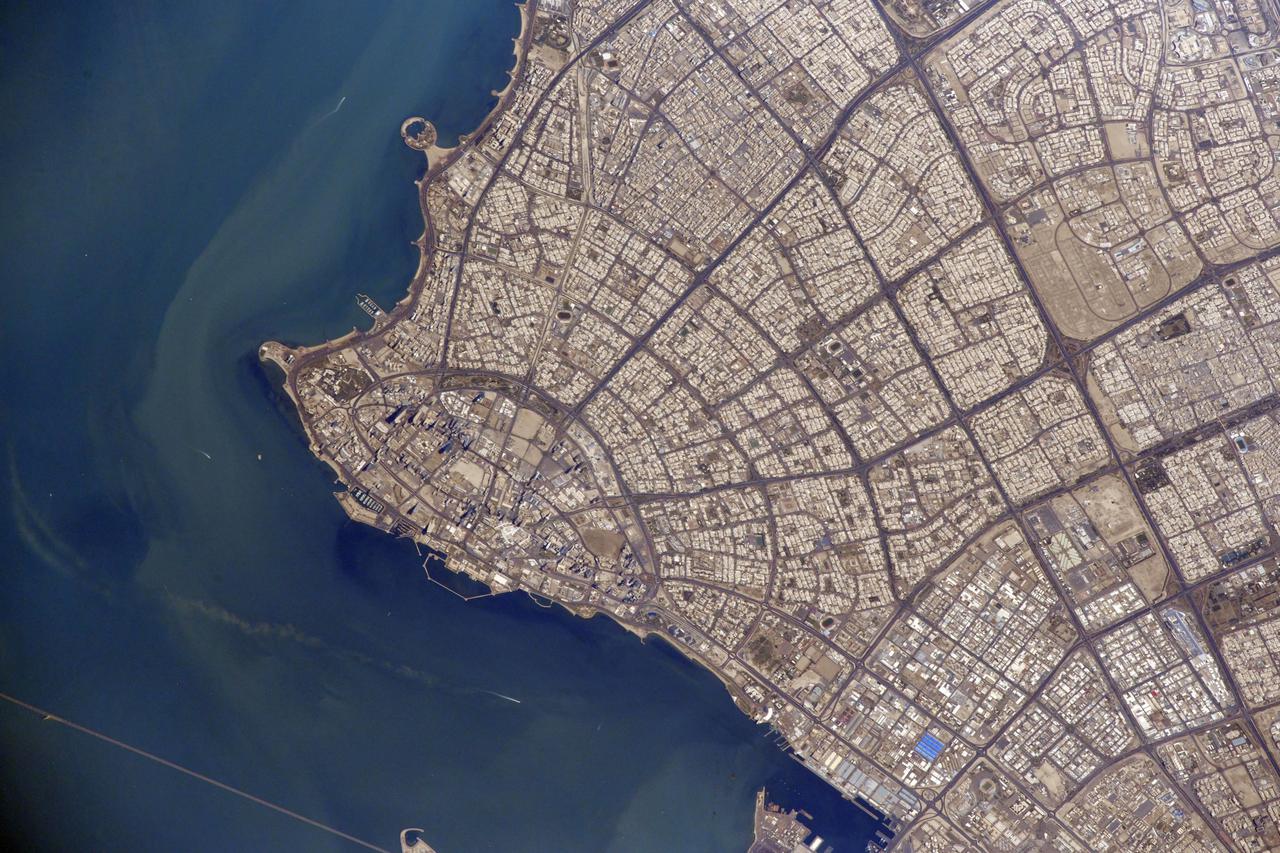 iss064e039346 (Feb. 26, 2021) --- Kuwait City, population 4.1 million, on the south shore of Kuwait Bay is pictured from the International Space Station as it orbited 261 miles above the Persian Gulf. Credit: Roscosmos